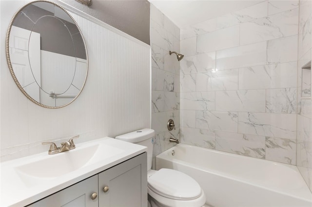 full bathroom with tiled shower / bath combo, toilet, and vanity