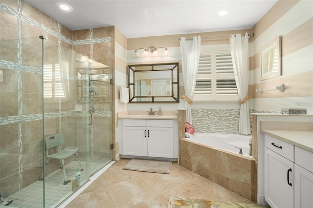 bathroom with plus walk in shower and vanity