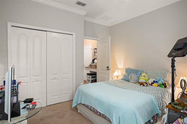 bedroom with light colored carpet, a closet, and ornamental molding