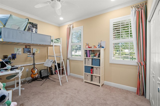 carpeted bedroom with crown molding and ceiling fan