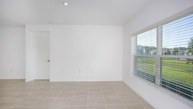 unfurnished room with light tile patterned floors