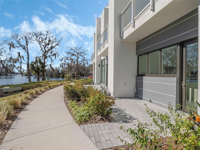 view of side of property with a water view