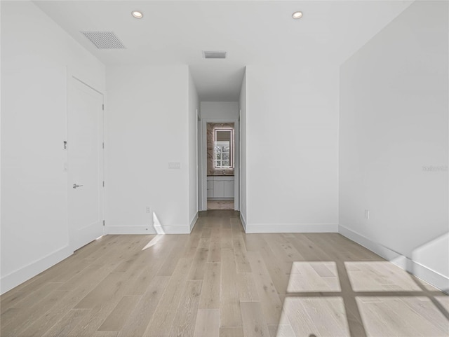 spare room featuring light hardwood / wood-style flooring