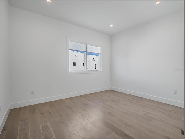 unfurnished room featuring light hardwood / wood-style flooring