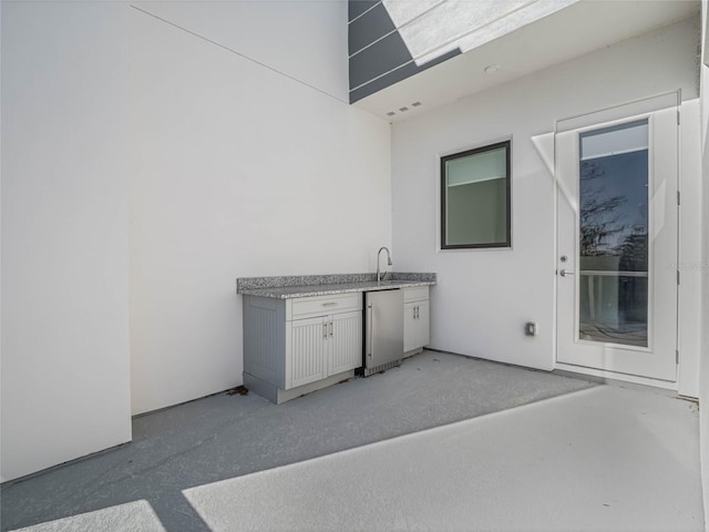 view of patio / terrace with exterior kitchen and sink