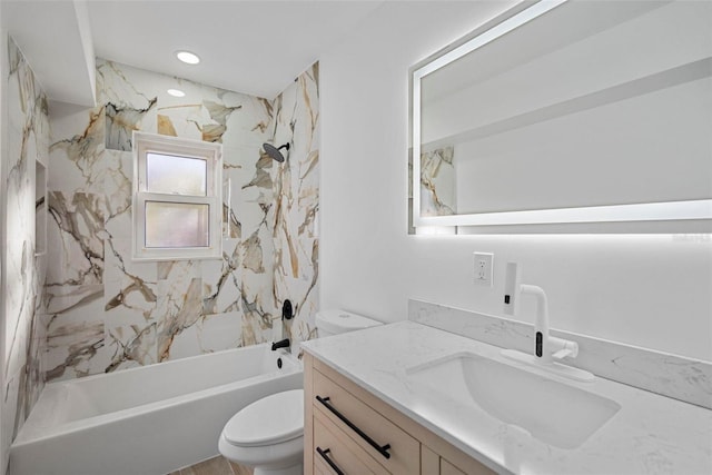 full bathroom featuring vanity, toilet, and tiled shower / bath combo