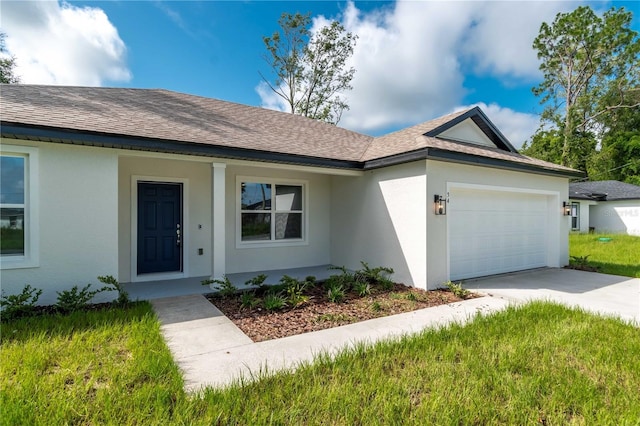 ranch-style house featuring covered porch and a garage