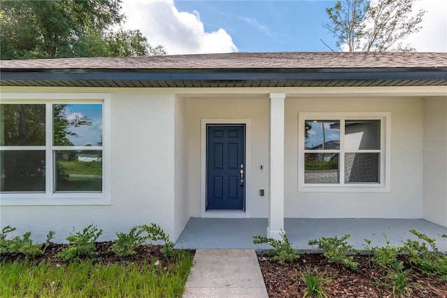 entrance to property with covered porch