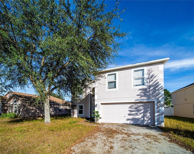 view of front of home with a garage and a front yard