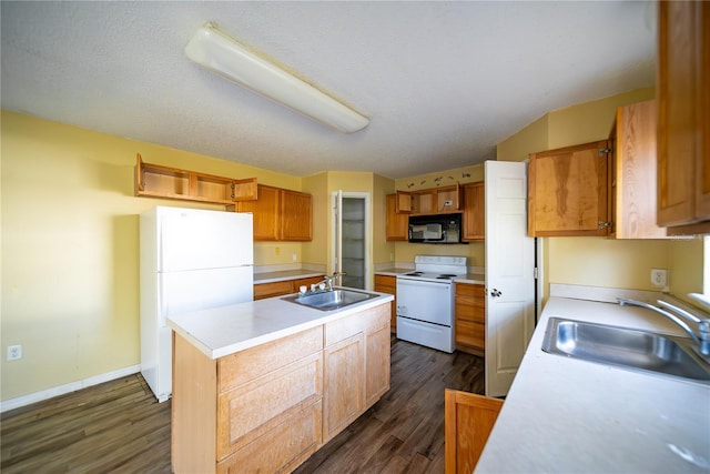 kitchen featuring dark hardwood / wood-style floors, a kitchen island, white appliances, and sink