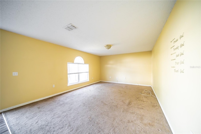 unfurnished room featuring carpet