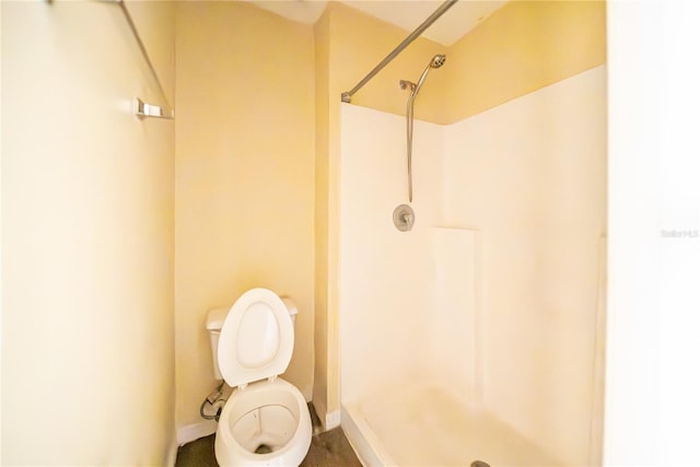 bathroom with toilet and walk in shower