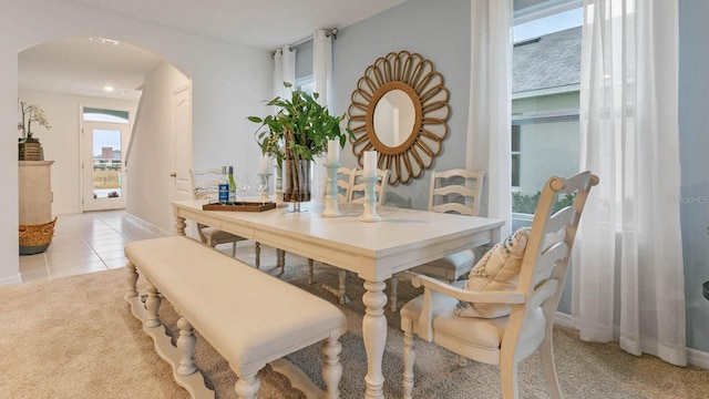 dining space with light carpet