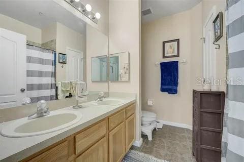 bathroom with vanity and toilet