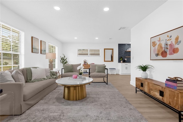 living room with light hardwood / wood-style flooring