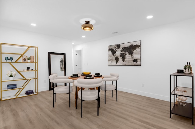 dining space featuring light hardwood / wood-style flooring