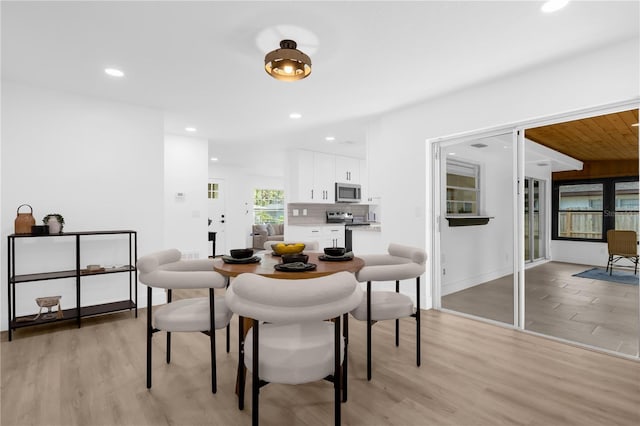 dining room with light hardwood / wood-style floors