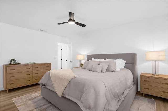 bedroom featuring ceiling fan and light wood-type flooring