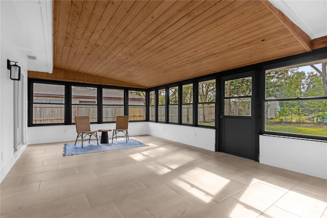 unfurnished sunroom with vaulted ceiling and wooden ceiling