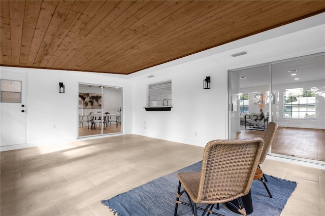 interior space with wooden ceiling and vaulted ceiling