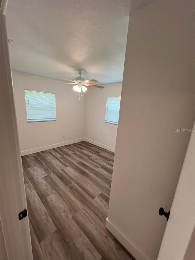 unfurnished room featuring hardwood / wood-style floors and ceiling fan