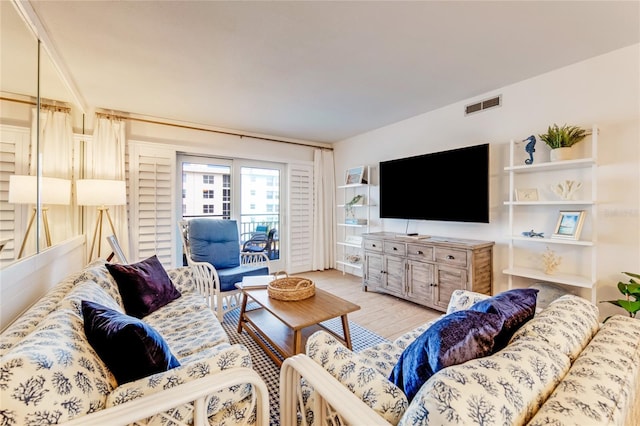 living room with light hardwood / wood-style flooring