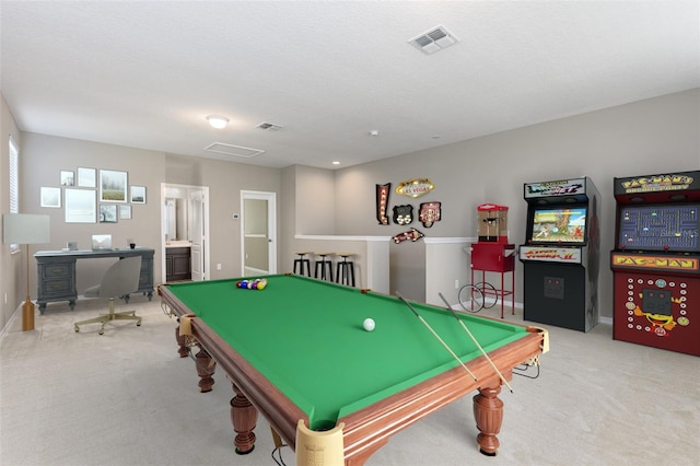 recreation room featuring a textured ceiling, light colored carpet, and billiards