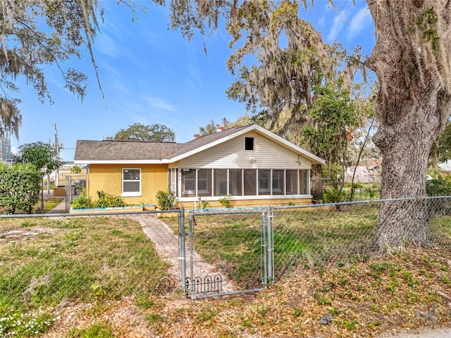 view of front of property with a sunroom