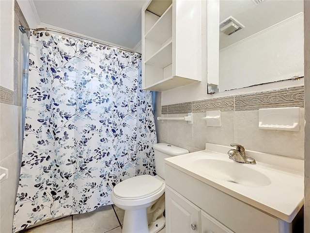 bathroom with curtained shower, tile walls, vanity, toilet, and tile patterned floors