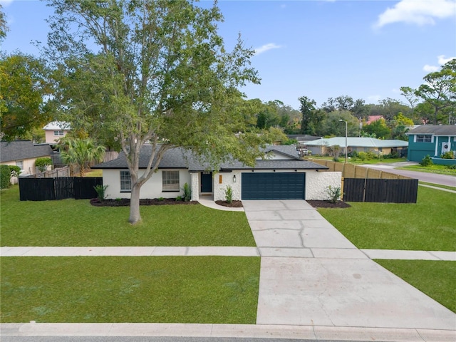 view of front of house with a front lawn and a garage