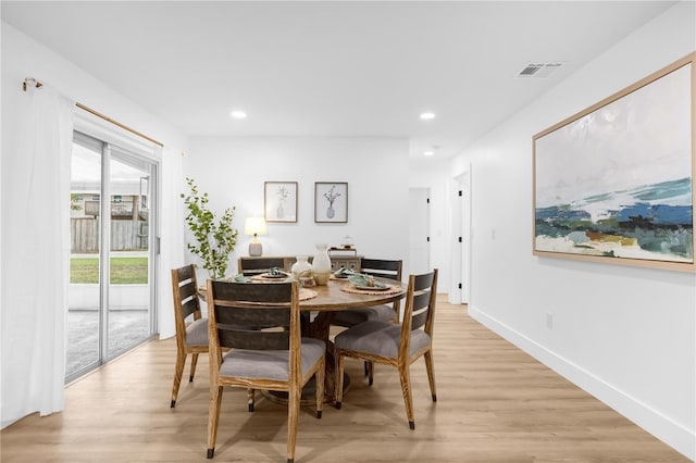 dining room with light wood-type flooring