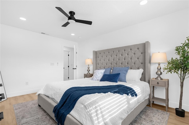 bedroom featuring ceiling fan and light hardwood / wood-style flooring