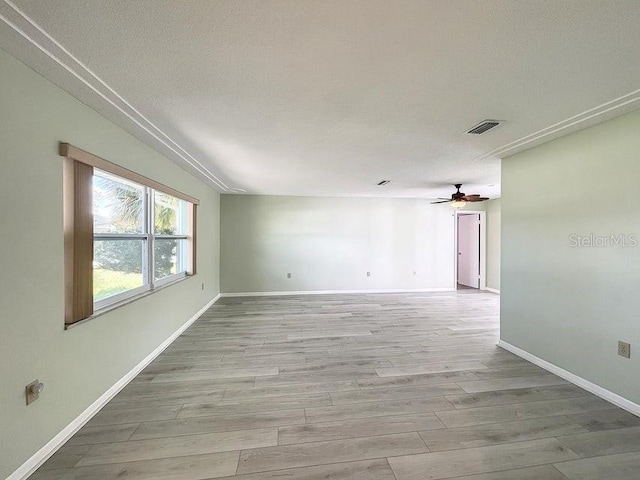 unfurnished room featuring light hardwood / wood-style floors and ceiling fan