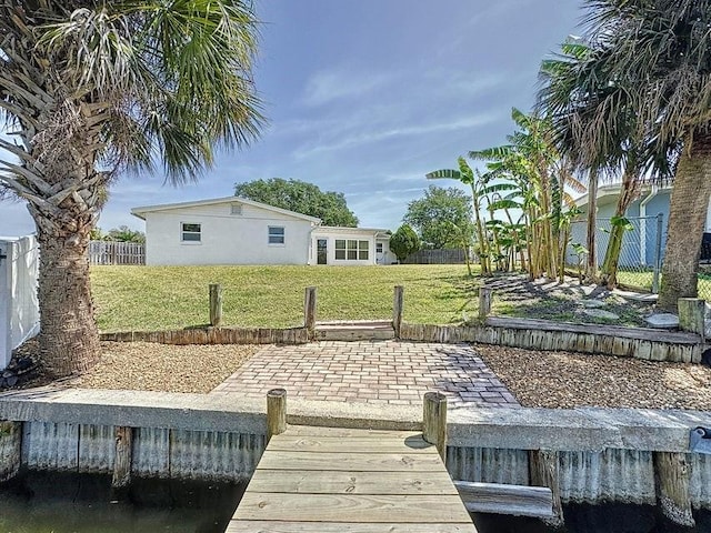 dock area featuring a yard and a patio area