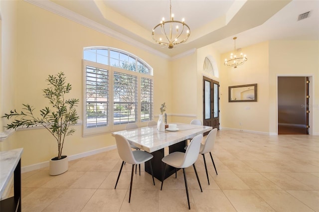 dining space with french doors, crown molding, a tray ceiling, a notable chandelier, and light tile patterned flooring