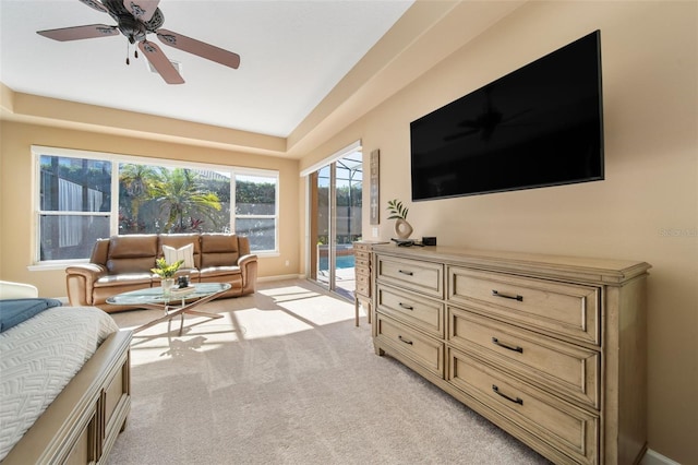 carpeted bedroom with ceiling fan and access to exterior