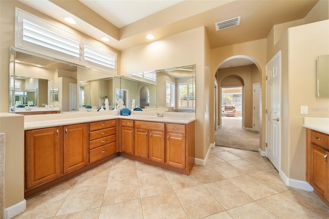 bathroom with tile patterned floors and vanity