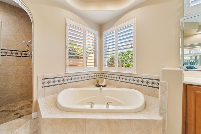 bathroom with vanity and separate shower and tub