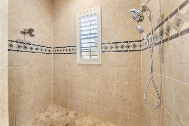 bathroom with a tile shower