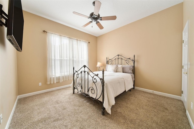 bedroom featuring light colored carpet and ceiling fan