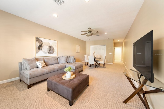 living room with ceiling fan and light carpet