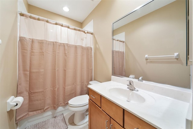 bathroom with tile patterned flooring, a shower with curtain, vanity, and toilet