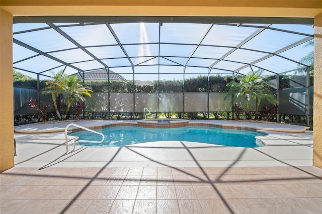 view of pool with glass enclosure, an in ground hot tub, and a patio area