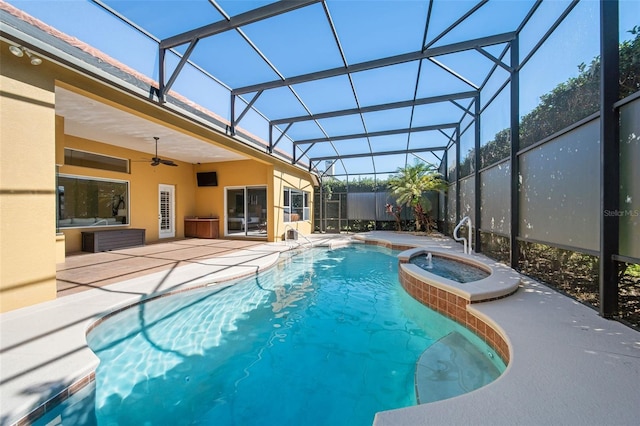 view of pool with a lanai, a patio area, an in ground hot tub, and ceiling fan