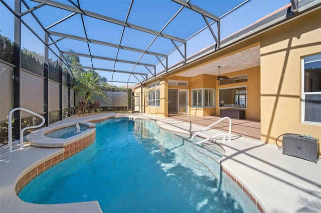 view of swimming pool featuring an in ground hot tub, a patio, ceiling fan, and a lanai