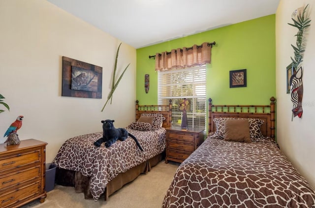 bedroom featuring light carpet