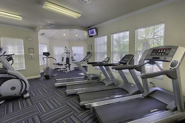 exercise room with crown molding and ceiling fan