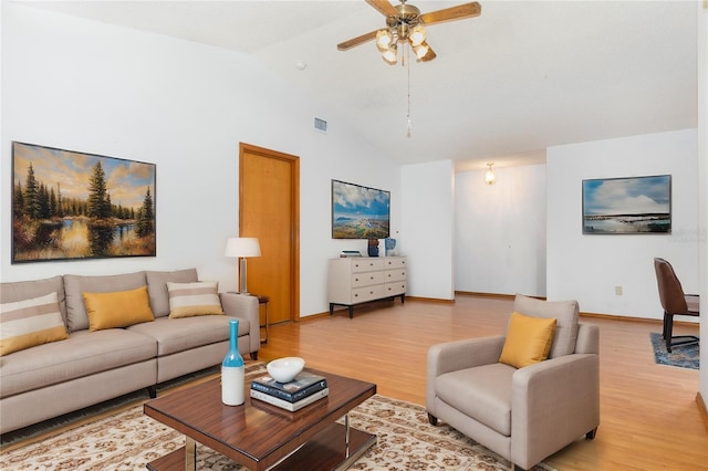 living room featuring ceiling fan, hardwood / wood-style floors, and high vaulted ceiling