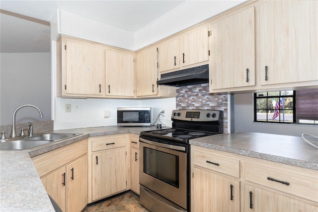 kitchen with light brown cabinets, sink, and appliances with stainless steel finishes