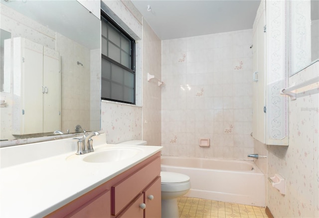 full bathroom featuring vanity, toilet, and tiled shower / bath